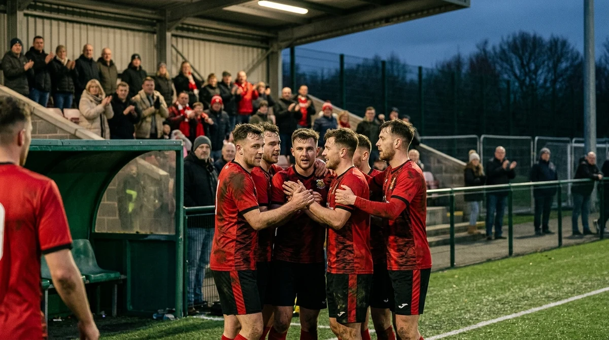 Illustrative football scene showing players celebrating Trefelin’s first Cymru Premier victory after a 3-1 away win.